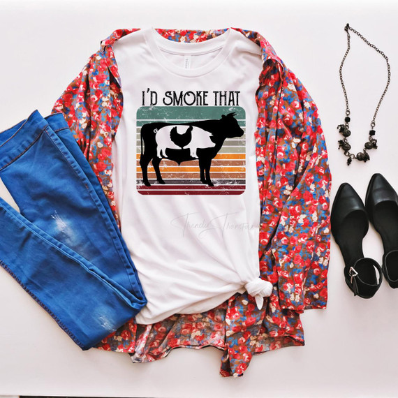 I'd Smoke That BBQ (No Pot) Sublimation Transfer T-Shirt, white T-shirt with barbecue cow silhouette and retro striped background in the image.