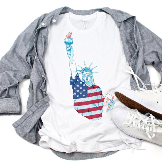 Statue of Liberty Patriotic 4th of July Sublimation Transfer, white t-shirt featuring an artistic representation of the Statue of Liberty with patriotic colors and designs.
