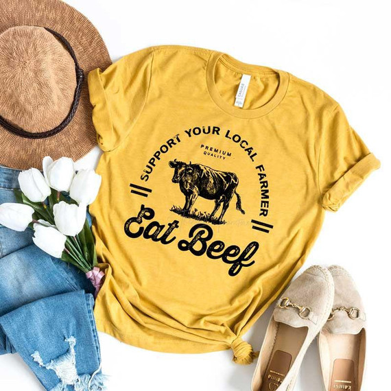 Support Your Local Farmer Eat Beef Screen Print Heat Transfer, yellow T-shirt with cow graphic and text design.