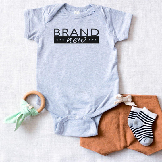 Product: Brand New Infant FINAL STOCK Screen Print Heat Transfer, image showing a light gray baby onesie with black and white text and star design.
