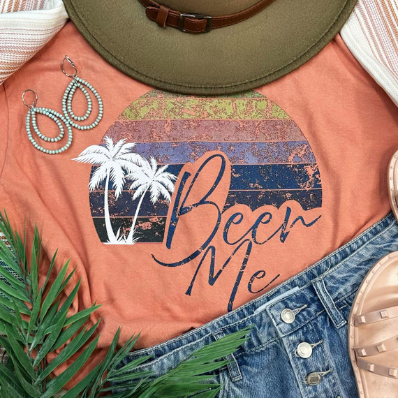 Beer Me Screen Print Transfer, vibrant graphic design featuring a sunset with palm trees and the text 'Beer Me' on a peach-colored t-shirt.