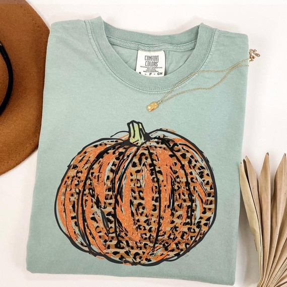 Leopard Orange Glitter Look Pumpkin Screen Print Heat Transfer, displayed on a mint green T-shirt.