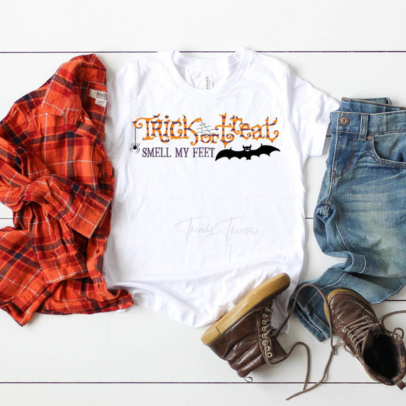 Trick or Treat Smell My Feet Halloween Sublimation Transfer T-Shirt, featuring Halloween themed text and graphics including a spider and bat.