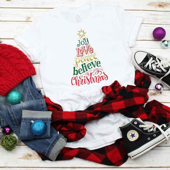 Christmas Tree Word Art Sublimation Transfer, festive Christmas design on white T-shirt with colorful words forming a tree shape.