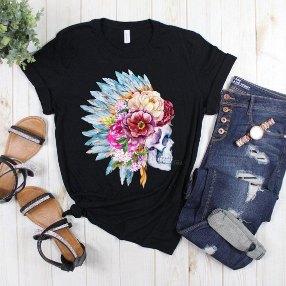 Skull with Indian Headdress Screen Print Heat Transfer, featuring a skull adorned with colorful flowers and feathers on a black T-shirt, paired with distressed jeans and sandals.