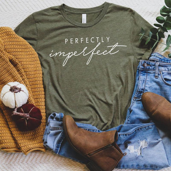Perfectly Imperfect White Screen Print Transfer, white text design on an olive green T-shirt, fashion clothing item for fall style.