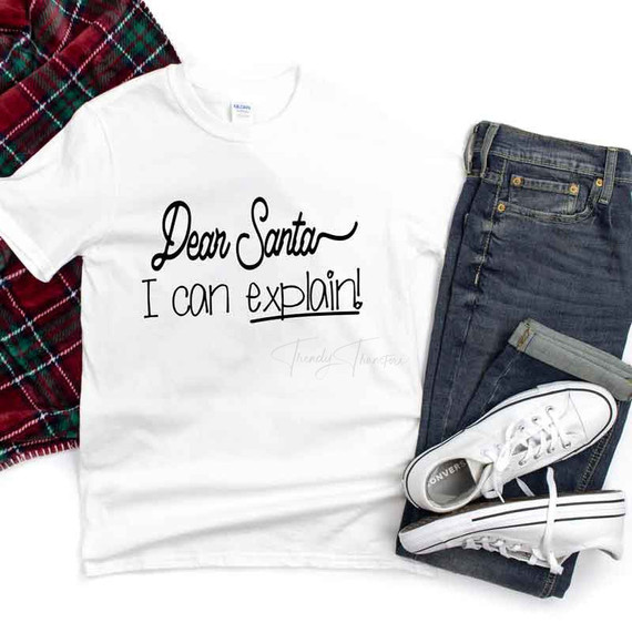 Dear Santa I Can Explain Sublimation Transfer, white t-shirt with humorous message and casual clothing items displayed.