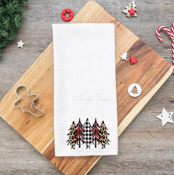 Patterned Trees Tea Towel Screen Print Heat Transfer, featuring a festive design of Christmas trees with mixed patterns on a white towel.