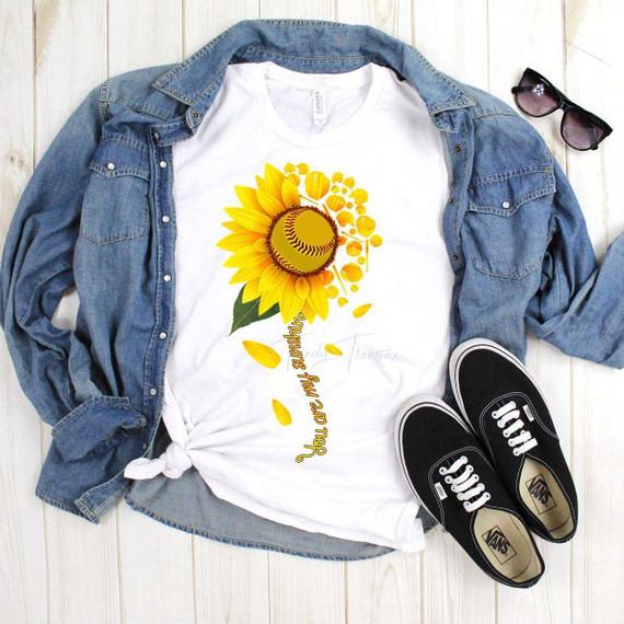 You Are My Sunshine Softball Sublimation Transfer on white T-shirt, with sunflower and baseball design, paired with denim jacket, sunglasses, and black Vans sneakers.