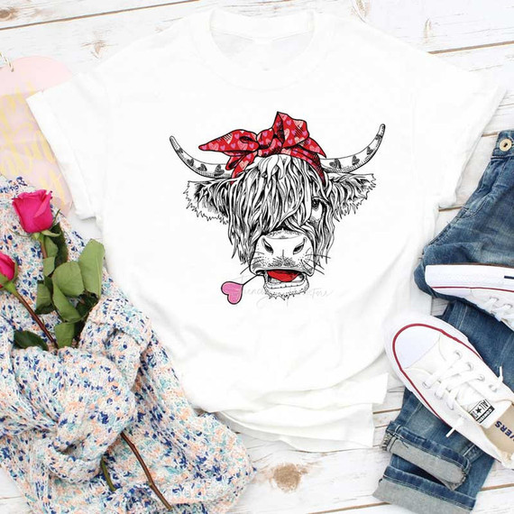 Shaggy Cow Valentines Sublimation Transfer, white T-shirt with a cartoon shaggy cow wearing a red bandana and sticking out its tongue.