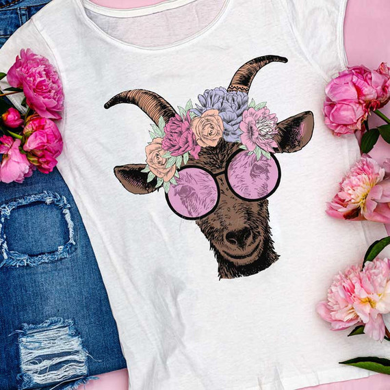 Hippie Goat Sublimation Transfer, graphic T-shirt featuring a goat wearing purple sunglasses and a floral crown with pink, purple, and beige flowers.