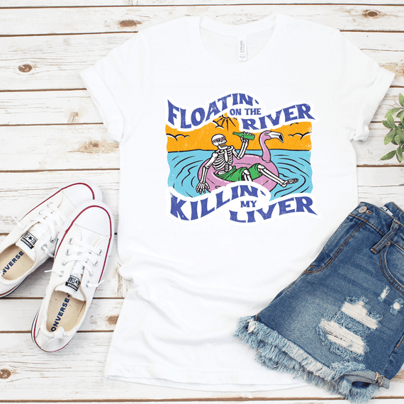 Floatin' on the River Killin' My Liver Skeleton Sublimation Transfer, colorful skeleton relaxing on a flamingo float with sunset background, humorous summer t-shirt design.
