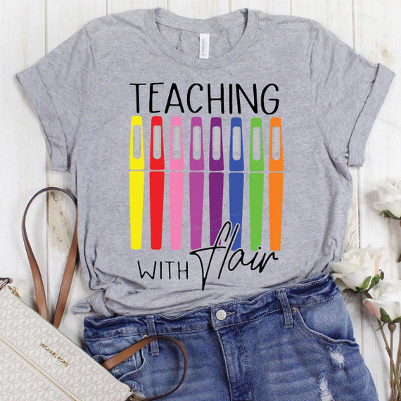 Teaching With Flair Screen Print Heat Transfer on a Gray T-shirt, colorful marker design and playful text for educators and teachers.