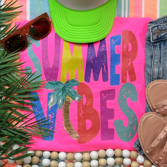 Summer Vibes Palm Tree Screen Print Heat Transfer, vibrant pink summer-themed graphic t-shirt with colorful text and a palm tree illustration.