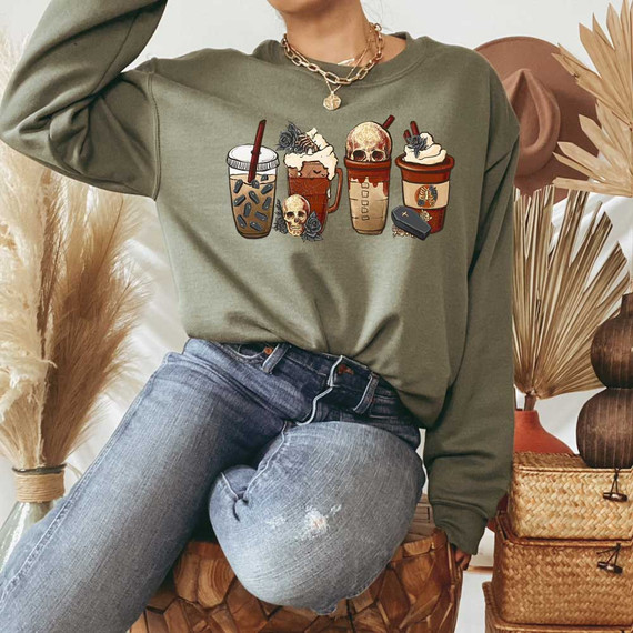 Goth Lattes DTF Heat Transfer, illustrated gothic coffee drinks with skulls and spooky designs on a sweatshirt.