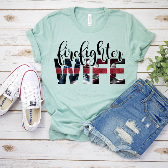 Fire Fighter Wife Red Line Screen Print Heat Transfer T-shirt, with an American flag design and bold lettered words 'firefighter' and 'WIFE' on a pastel green background.
