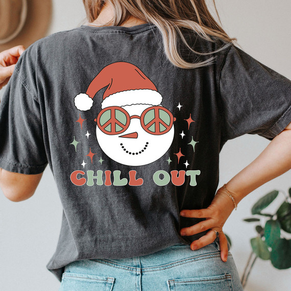 Chill Out Snowman Screen Print Heat Transfer, black T-shirt with a graphic of a snowman wearing sunglasses and a Santa hat, with the words 'Chill Out' in colorful letters.