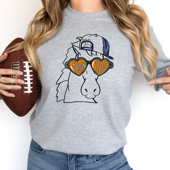 Broncos Mascot DTF Transfer, novelty t-shirt design featuring a cartoon horse mascot wearing sunglasses with 'Broncos' written on the glasses, a cap, and the phrase 'game day'.