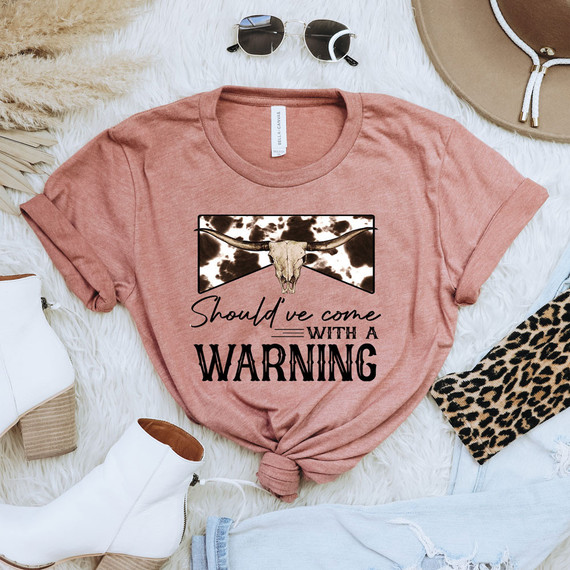 Should've Come With A Warning BLACK DTF Transfer, graphic t-shirt with a cow skull and cow print design and humorous warning message.