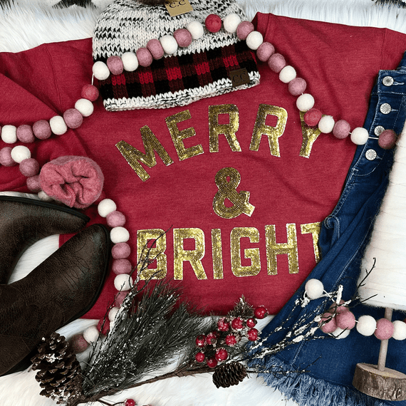 Merry & Bright Glitter Sequined Patch, festive holiday clothing decoration with shimmer gold sequins on a red T-shirt.