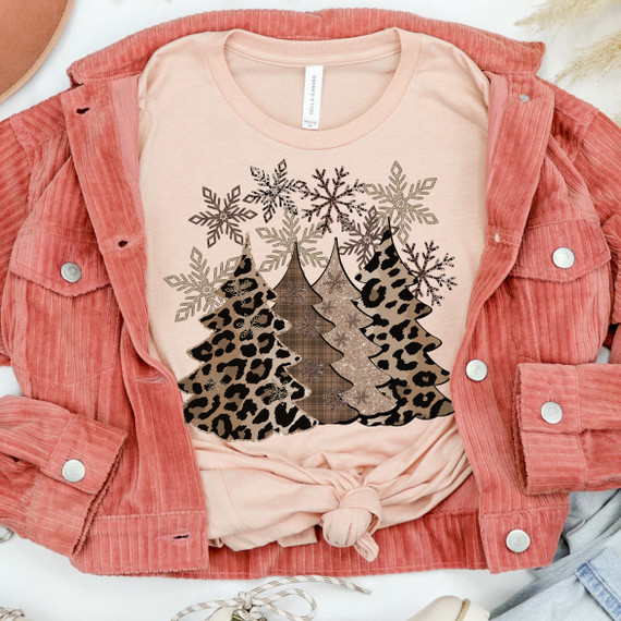 Leopard Christmas Trees Screen Print Transfer, Christmas-themed leopard print trees with snowflake accents on a pink T-shirt.