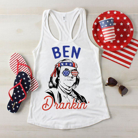 Ben Drankin' Patriotic Sublimation Transfer, patriotic tank top with an illustration of a person wearing American flag sunglasses and bandana, surrounded by American-themed accessories like flip-flops, paper plates, and napkins.