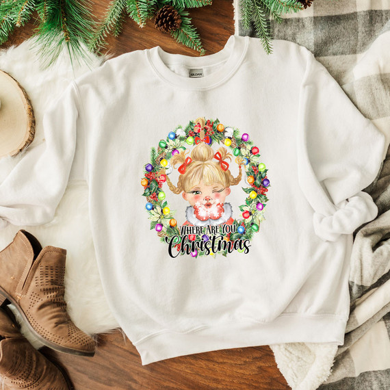 Where Are You Christmas DTF Transfer, Christmas-themed sweatshirt featuring a girl with pigtails surrounded by a holiday wreath with colorful lights and ornaments.