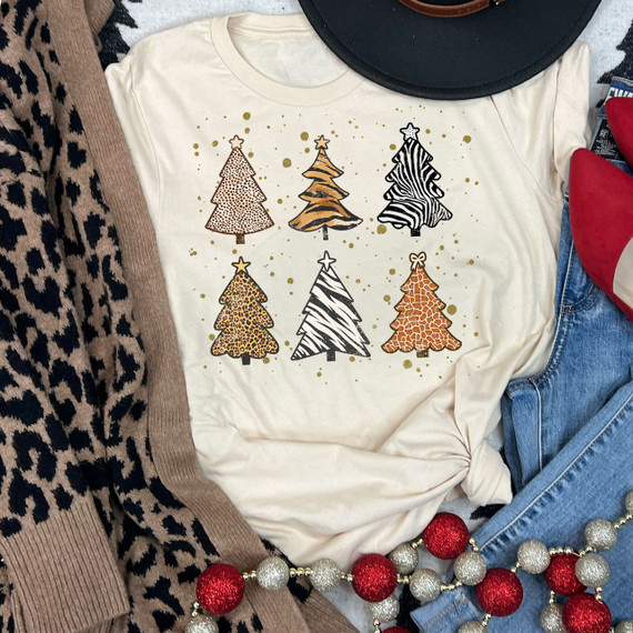 Animal Print Christmas Trees Screen Print Heat Transfer, festive Christmas trees with animal print patterns on a cream-colored t-shirt.