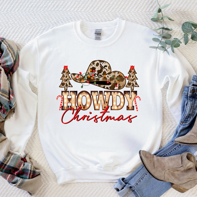 Howdy Christmas Sublimation Transfer, Christmas-themed sweatshirt with holiday design including cowboy hat, Christmas trees, candy canes, and text.