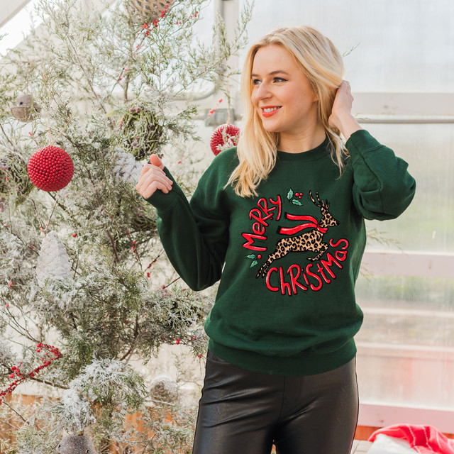 Leopard Reindeer DTF Heat Transfer, Christmas sweater with leopard and reindeer design, holiday Christmas apparel for women.