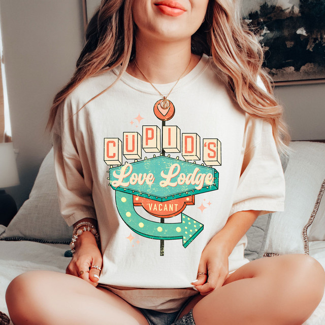 Product Cupid's Love Lodge Screen Print Heat Transfer, colorful retro sign design with lights, lettering, and arrow, suitable for decorating apparel and textiles.
