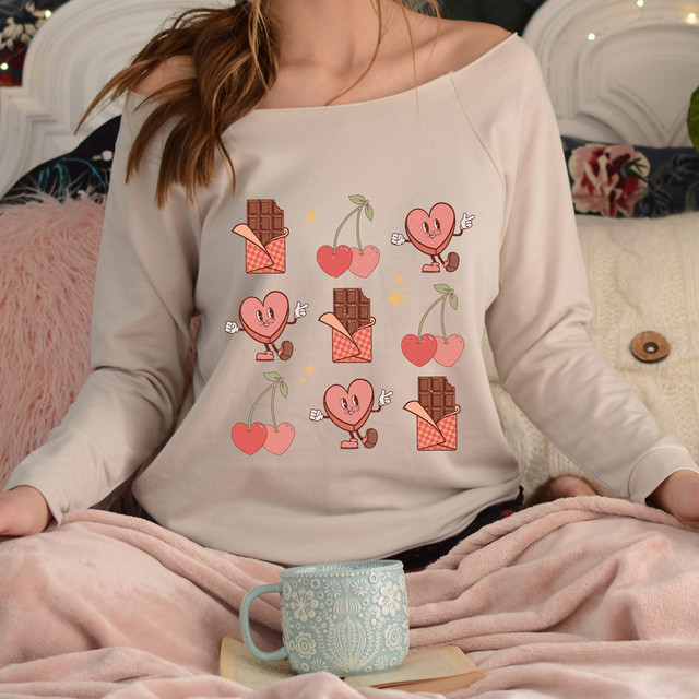Retro Valentine DTF Heat Transfer, a colorful design featuring cartoon hearts, cherries, and chocolates on a woman's sweater.