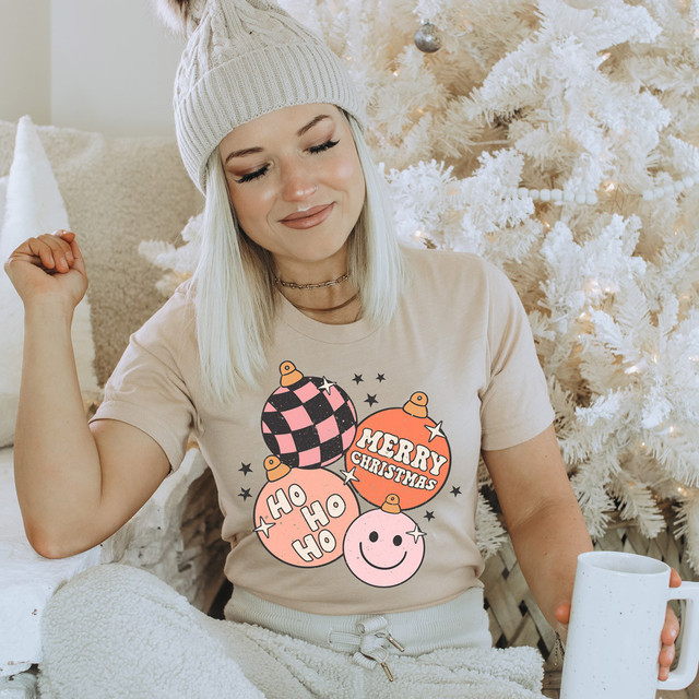 Retro Ornaments DTF Heat Transfer, Christmas themed print featuring decorated Christmas ornaments with holiday greetings and smiling faces on a fabric.