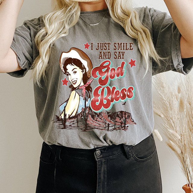 I Just Smile And Say God Bless DTF Heat Transfer, graphic heat transfer design on a gray t-shirt featuring a woman wearing a hat and cactus landscape