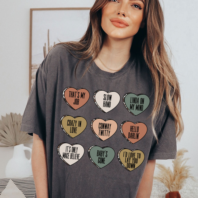 Conway Candy Hearts DTF Heat Transfer, colorful heart-shaped designs with playful phrases on a woman's T-shirt.