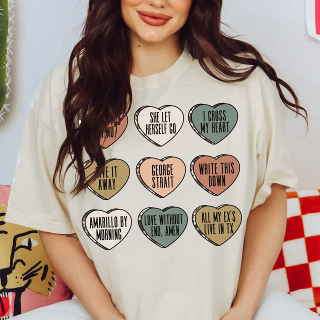 George Candy Hearts DTF Heat Transfer, colorful heart-shaped designs with playful text on a white t-shirt.