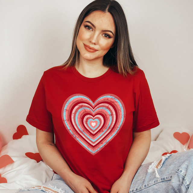 Retro Heart DTF Heat Transfer, a vibrant red T-shirt with a colorful distressed heart design pattern.
