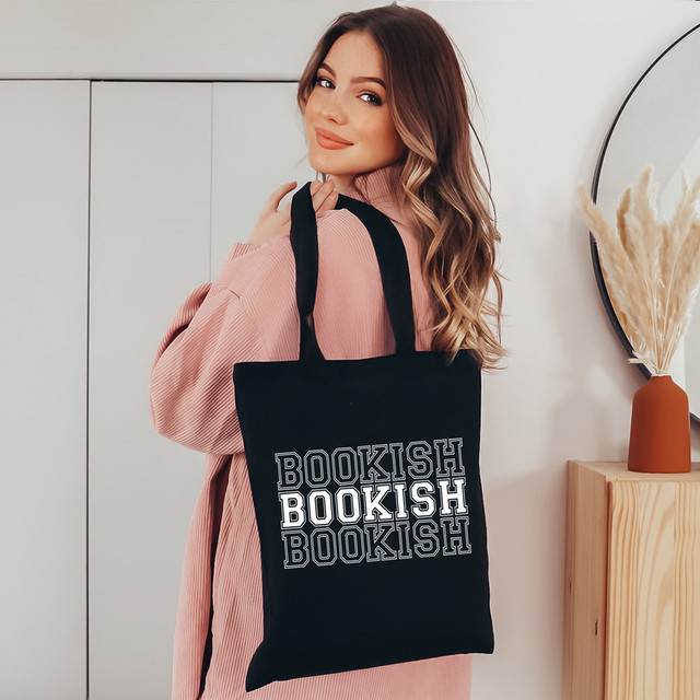 Bookish WHITE DTF Heat Transfer, black tote bag with white and black outlined text design.