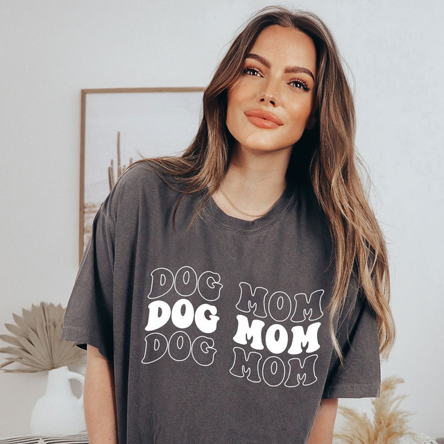 Dog Mom WHITE DTF Heat Transfer, woman wearing a T-shirt with 'Dog Mom' design in white text