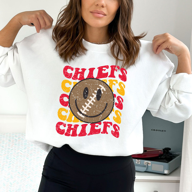 Chiefs Happy Face DTF Heat Transfer, cheerful smiling football face design on a white sweatshirt.