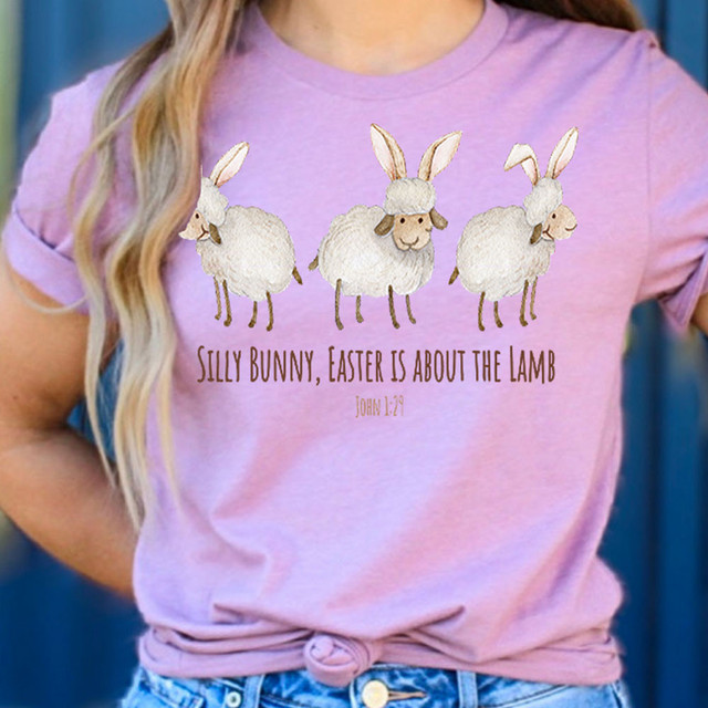 Silly Bunny, Easter Is About The Lamb DTF Heat Transfer, colorful t-shirt with three embroidered sheep wearing bunny ears and a quote from John 1:29.