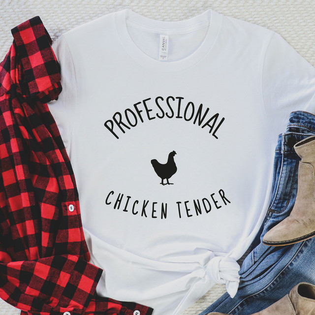 Professional Chicken Tender DTF Heat Transfer, white T-shirt with black text and chicken graphic design.