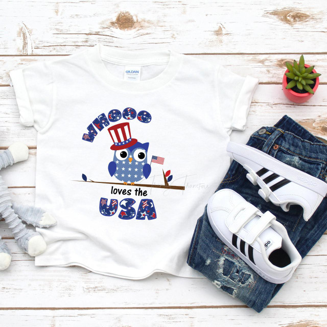 Patriotic Owl Whooo Loves The USA Sublimation Transfer, illustrated owl wearing a patriotic top hat with stars and stripes, surrounded by USA-themed decorative elements, on a white T-shirt for Independence Day celebrations.
