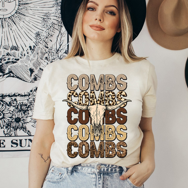 Combs Bullhead DTF Heat Transfer, woman wearing a graphic t-shirt with a bull skull and leopard print text design.