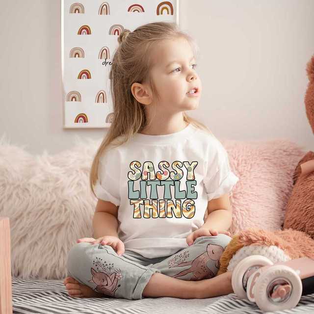 Sassy Little Thing Boho DTF Heat Transfer, colorful and playful design on a girl's white t-shirt.