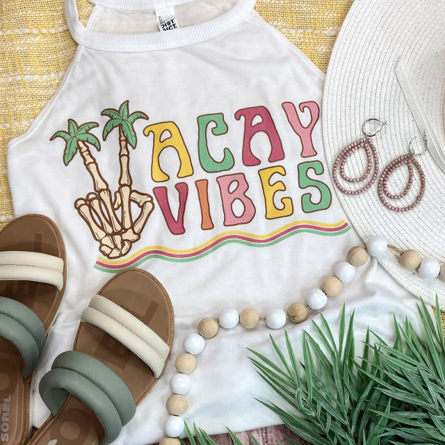 Vacay Vibes Screen Print Heat Transfer, colorful tropical-themed design with palm trees and the phrase "Vacay Vibes" printed on a white T-shirt surrounded by summer accessories.