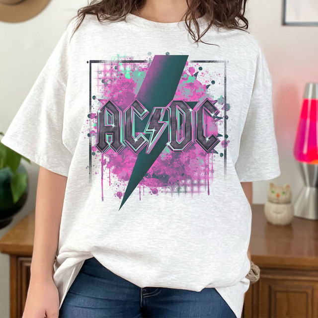Band Tee AC Sublimation Transfer, graphic design of a lightning bolt and AC/DC logo on a white t-shirt worn by a person.