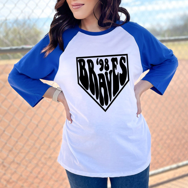 98 Wavy Home Plate DTF Heat Transfer, a black graphic design of a diamond shape with text inside on a white and blue baseball T-shirt.