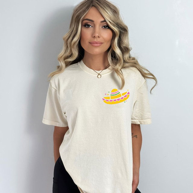 Sombrero DTF Heat Transfer, colorful sombrero design on a white T-shirt worn by a woman.