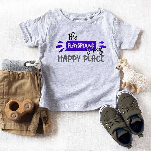 The Playground Is My Happy Place Back To School Sublimation Transfer, a gray children's t-shirt with colorful text design.